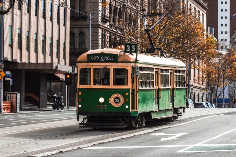 green and yellow melbourne city circle tram on road during daytime
