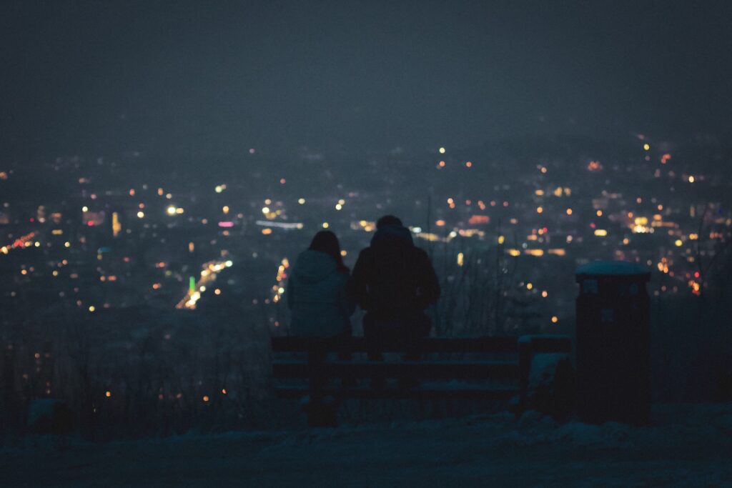2 person standing on top of building during night time date ideas