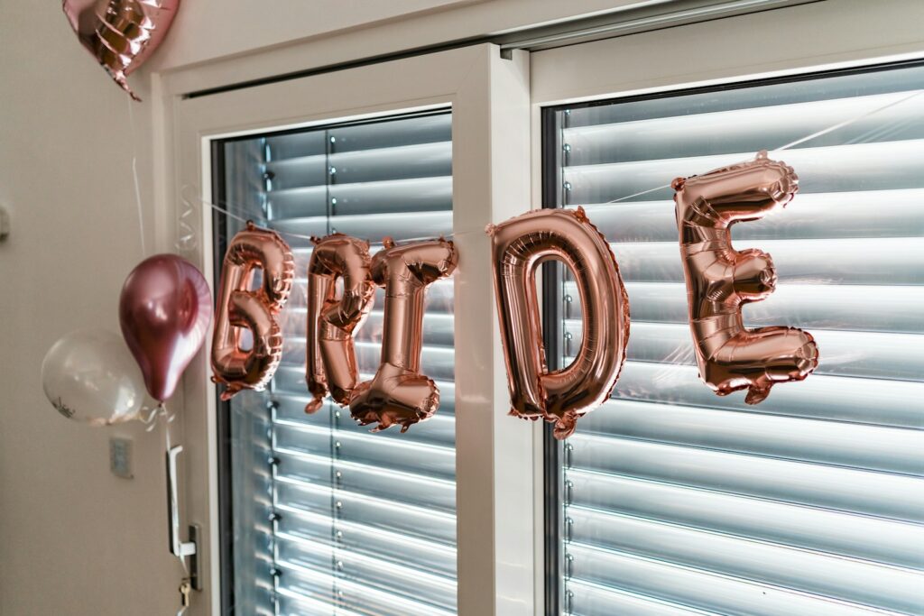 a balloon that says bride hanging from a window
