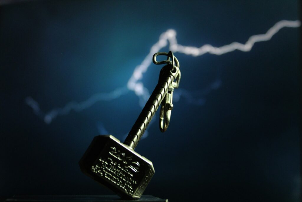 silver skeleton key with black and silver key thors hammer mjolner